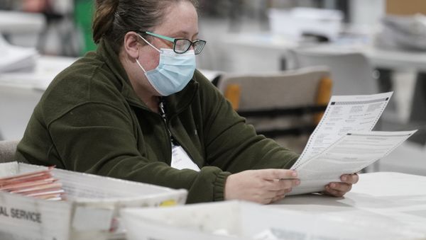 An officials works on ballots at the Gwinnett County Voter Registration and Elections Headquarters, Friday, Nov. 6, 2020, in Lawrenceville, near Atlanta. - Sputnik International