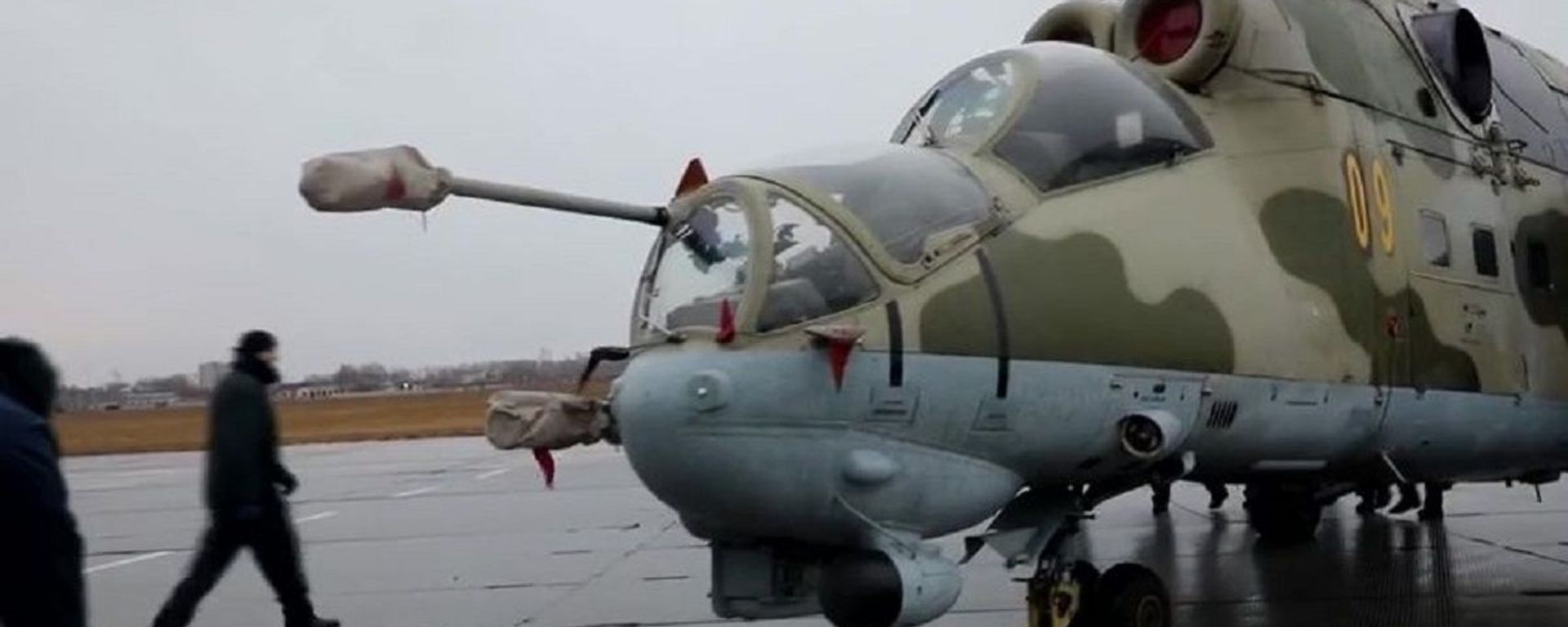 In this handout video grab released by the Russian Defence Ministry, a helicopter is loaded onto a transport plane heading to Nagorno-Karabakh, at an airport in Moscow region, Russia - Sputnik International, 1920, 03.03.2022