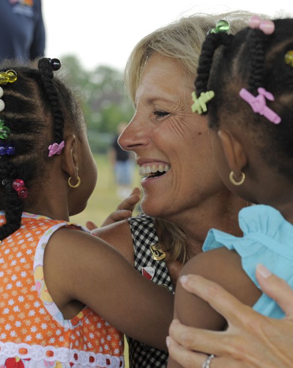 Jill Biden, wife of vice-president Joe Biden, hugs two children during the celebrations on Independence Day at Kessler field, a US Army garrison, in Schweinfurt, southern Germany, on Saturday, 4 July 2009. Jill Biden, wife of vice-president Joe Biden, hugs two children during the celebrations on Independence Day at Kessler field, a US Army garrison, in Schweinfurt, southern Germany, on Saturday, 4 July 2009. - Sputnik International