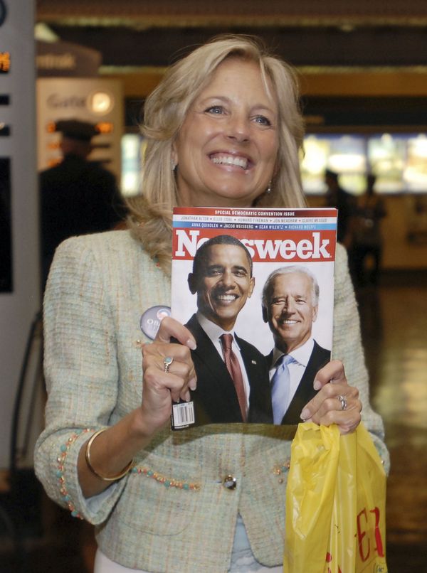 Jill Biden, wife of Delaware senator Joe Biden, the vice-presidential half of the soon-to-be-official Democrat ticket, holds up a news magazine to show her husband when they made a surprise appearance Monday 25 August 2008 at the Amtrak railway station in Wilmington, Delaware. Jill Biden, wife of Delaware senator Joe Biden, the vice-presidential half of the soon-to-be-official Democrat ticket, holds up a news magazine to show her husband when they made a surprise appearance Monday 25 August 2008 at the Amtrak railway station in Wilmington, Delaware. - Sputnik International