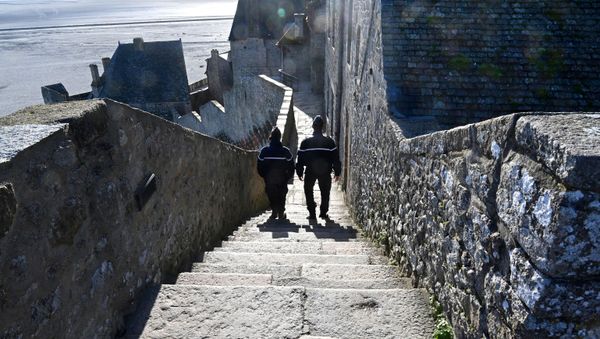 French gendarmes patrol on the defensive wall walk in Le Mont-Saint-Michel, Normandy, northwestern France, on November 12, 2020, as France is on a second lockdown aimed at containing the spread of Covid-19 pandemic caused by the novel coronavirus. French gendarmes patrol on the defensive wall walk in Le Mont-Saint-Michel, Normandy, northwestern France, on November 12, 2020, as France is on a second lockdown aimed at containing the spread of Covid-19 pandemic caused by the novel coronavirus. - Sputnik International