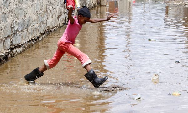 A child jumps as she wades through flood waters after the levels at Lake Naivasha swelled to a record high, pushing hundreds of people from surrounding farms around Naivasha town within Nakuru county, Kenya on 8 November 2020. A child jumps as she wades through flood waters after the levels at Lake Naivasha swelled to a record high, pushing hundreds of people from surrounding farms around Naivasha town within Nakuru county, Kenya on 8 November 2020. - Sputnik International