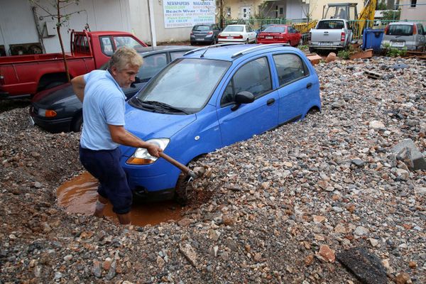 A local shovels mud blocking a car, after heavy rainfall in Malia on the island of Crete, Greece, 10 November 2020. A local shovels mud blocking a car, after heavy rainfall in Malia on the island of Crete, Greece, 10 November 2020. - Sputnik International