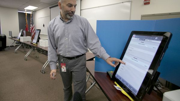  In this Sept. 16, 2019 file photo, Scott Tucker demonstrates the Dominion Voting system Georgia will use in Atlanta. - Sputnik International