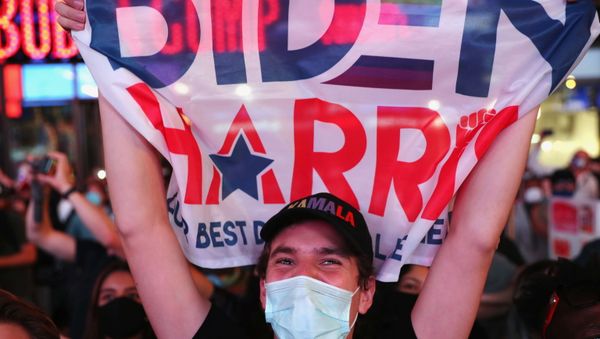A supporter reacts during a speech by Democratic vice presidential nominee Kamala Harris after media announced she and presidential nominee Joe Biden won the 2020 U.S. presidential election, on Times Square in New York City, U.S. November 7, 2020. REUTERS/Caitlin Ochs - Sputnik International