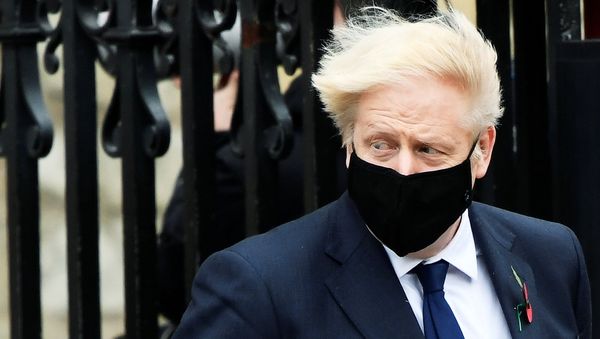 Britain's Prime Minister Boris Johnson wearing a face mask leaves the Westminster Abbey following a remembrance service on Armistice Day in London, Britain, November 11, 2020. Britain's Prime Minister Boris Johnson wearing a face mask leaves the Westminster Abbey following a remembrance service on Armistice Day in London, Britain, November 11, 2020. - Sputnik International