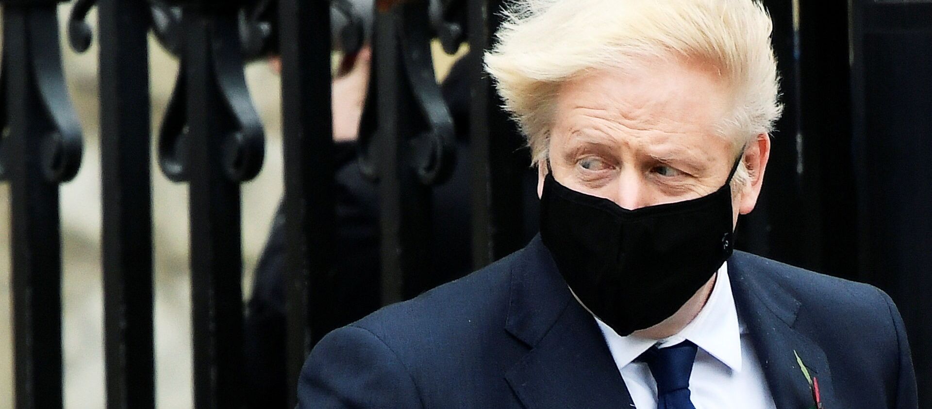 Britain's Prime Minister Boris Johnson wearing a face mask leaves the Westminster Abbey following a remembrance service on Armistice Day in London, Britain, November 11, 2020. Britain's Prime Minister Boris Johnson wearing a face mask leaves the Westminster Abbey following a remembrance service on Armistice Day in London, Britain, November 11, 2020. - Sputnik International, 1920, 21.11.2020