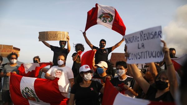 People hold signs and Peruvian flags during a rally after Peru's interim President Manuel Merino resigned, in Rio de Janeiro, Brazil, November 15, 2020.  - Sputnik International