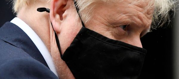 Britain's Prime Minister Boris Johnson, wearing a protective mask, leaves 10 Downing Street in London, Britain October 21, 2020 Britain's Prime Minister Boris Johnson, wearing a protective mask, leaves 10 Downing Street in London, Britain October 21, 2020 - Sputnik International
