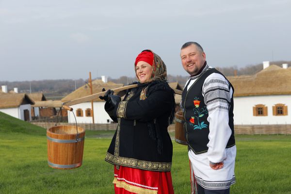 A woman and a man, both dressed in historical costumes, attend the opening of the Slobozhanschina ethno village in the Belgorod Region. A woman and a man, both dressed in historical costumes, attend the opening of the Slobozhanschina ethno village in the Belgorod Region. - Sputnik International