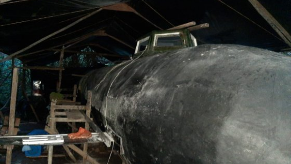 An electric-powered submarine with a cargo capacity of six tons that would have been used for smuggling narcotics out of Colombia. The submarine was found in a boatyard during a raid near the Cucurrupí River in the Chocó area of Colombia on November 5, 2020. - Sputnik International