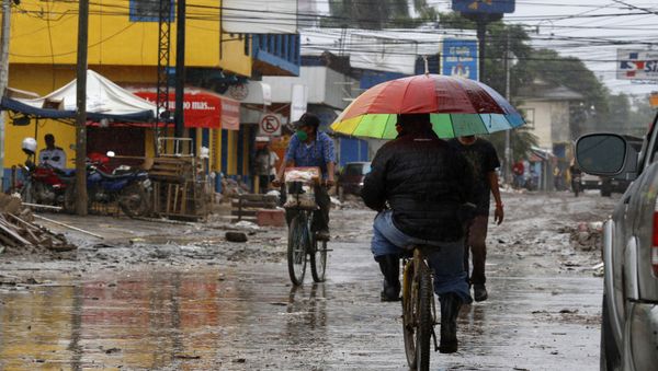 Locals move on street barely cleared from the debris of the last storm, before Hurricane Iota makes landfall in La Lima, Honduras, Monday, November 16, 2020. Hurricane Iota rapidly strengthened Monday into a Category 5 storm that is likely to bring catastrophic damage to the same part of Central America already battered by a powerful Hurricane Eta less than two weeks ago. - Sputnik International