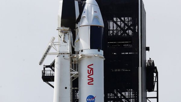 A SpaceX Falcon 9 rocket, topped with the Crew Dragon capsule, is readied to carry four astronauts on the first operational NASA commercial crew mission at Kennedy Space Center in Cape Canaveral, Florida, U.S., November 13, 2020 - Sputnik International