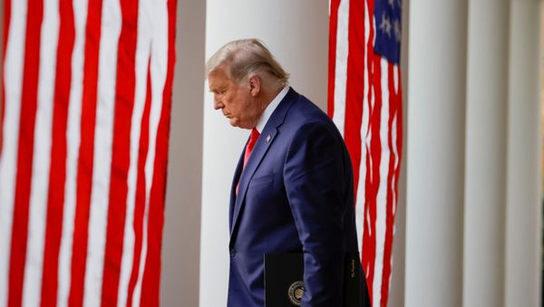 FILE PHOTO: U.S. President Donald Trump walks down the West Wing colonnade from the Oval Office to the Rose Garden to deliver an update on the so-called Operation Warp Speed program, the joint Defense Department and HHS initiative that has struck deals with several drugmakers in an effort to help speed up the search for effective treatments for the ongoing coronavirus disease (COVID-19) pandemic, at the White House in Washington, U.S., November 13, 2020 - Sputnik International