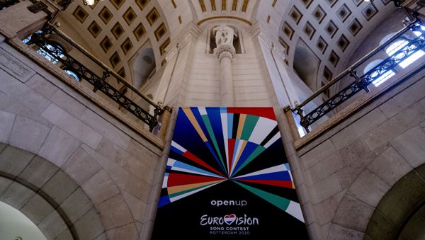A picture taken on January 28, 20120 shows a banner depicting the logo of the 65th edition of the Eurovision Song Contest in Rotterdam. - The 65th edition of the Eurovision Song Contest will take place in Rotterdam in May 2020, it will consist of two semi-finals on 12 and 14 May, and the final on 16 May 2020. - Sputnik International