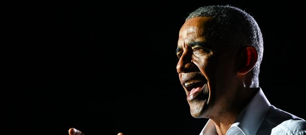 In this file photo taken on November 02, 2020, former US President Barack Obama speaks at a drive-in rally as he campaigns for Democratic presidential candidate former Vice President Joe Biden in Miami, Florida. - Obama says in his upcoming book that the divisions in America run deep and the departure of Donald Trump from the White House will not be enough to bridge the divide. In an excerpt from A Promised Land, which goes on sale on November 18, 2020, Obama reflects on the four years since he left office.  - Sputnik International