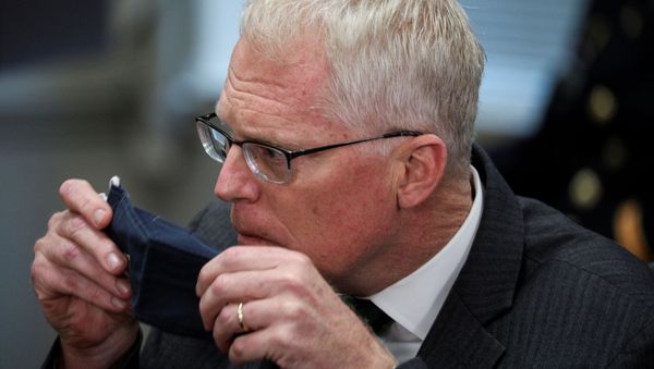 Acting U.S. Defense Secretary Christopher Miller removes his face mask during a meeting with Lithuania?s Defense Minister Raimundas Karobli at the Pentagon in nearby Arlington, Virginia, U.S., November 13, 2020 - Sputnik International