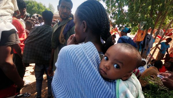 Ethiopians who fled the ongoing fighting in Tigray region gather in Hamdait village on the Sudan-Ethiopia border in eastern Kassala state, Sudan November 14, 2020.  - Sputnik International