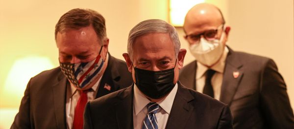 US Secretary of State Mike Pompeo, Israeli Prime Minister Benjamin Netanyahu, and Bahrain's Foreign Minister Abdullatif bin Rashid Al Zayani, all mask-clad due to the COVID-19 coronavirus pandemic, arrive for a press conference after their trilateral meeting in Jerusalem on November 18, 2020. US Secretary of State Mike Pompeo, Israeli Prime Minister Benjamin Netanyahu, and Bahrain's Foreign Minister Abdullatif bin Rashid Al Zayani, all mask-clad due to the COVID-19 coronavirus pandemic, arrive for a press conference after their trilateral meeting in Jerusalem on November 18, 2020. - Sputnik International