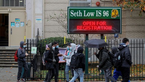 Students exit a school as the spread of coronavirus disease (COVID-19) continues, in Brooklyn, New York - Sputnik International