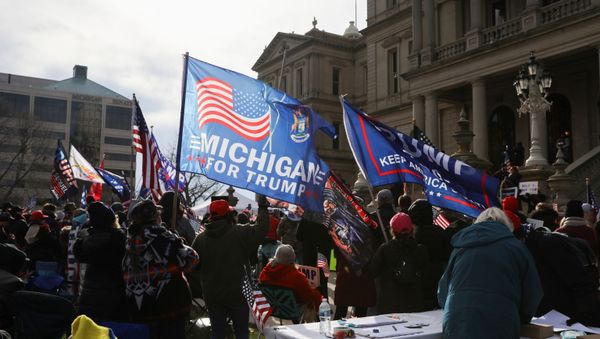 Supporters of U.S. President Donald Trump participate in a Stop the Steal protest after the 2020 U.S. presidential election was called for Democratic candidate Joe Biden, in Lansing, Michigan, U.S. 14 November 2020. Supporters of U.S. President Donald Trump participate in a Stop the Steal protest after the 2020 U.S. presidential election was called for Democratic candidate Joe Biden, in Lansing, Michigan, U.S. 14 November 2020. - Sputnik International