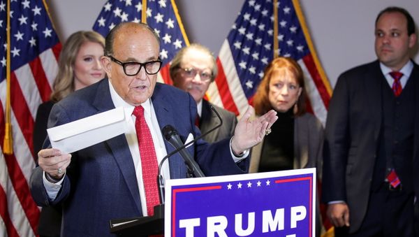 Former New York City Mayor Rudy Giuliani, personal attorney to US President Donald Trump, holds what he identifies as a replica mail-in ballot as he speaks about the 2020 US presidential election results during a news conference in Washington, 19 November 2020. REUTERS/Jonathan Ernst - Sputnik International
