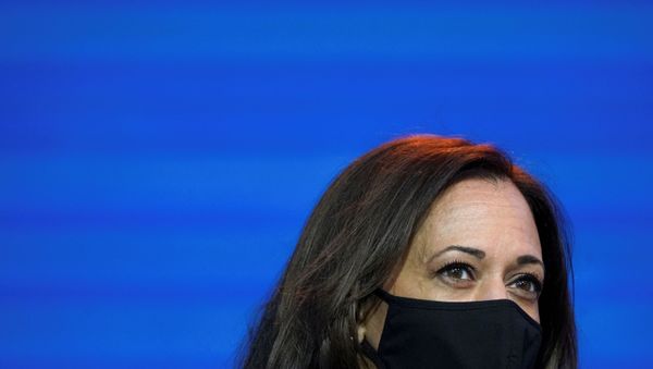 U.S. Vice President-elect Kamala Harris listens as U.S. President-elect Joe Biden speaks about the U.S. economy  following their briefing with economic advisers in Wilmington, Delaware, U.S., November 16, 2020. - Sputnik International