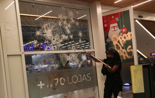 A demonstrator damages glass at a shopping mall during a march in Sao Paulo on National Black Consciousness Day and in protest against the death of Joao Alberto Silveira Freitas, a Black man beaten to death at a market in Porto Alegre, Brazil, November 20, 2020. A demonstrator damages glass at a shopping mall during a march in Sao Paulo on National Black Consciousness Day and in protest against the death of Joao Alberto Silveira Freitas, a Black man beaten to death at a market in Porto Alegre, Brazil, November 20, 2020. - Sputnik International