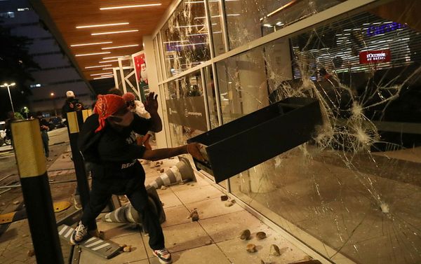 A demonstrator damages a storefront during a march in Sao Paulo on National Black Consciousness Day and in protest against the death of Joao Alberto Silveira Freitas, a Black man beaten to death at a market in Porto Alegre, Brazil, November 20, 2020 A demonstrator damages a storefront during a march in Sao Paulo on National Black Consciousness Day and in protest against the death of Joao Alberto Silveira Freitas, a Black man beaten to death at a market in Porto Alegre, Brazil, November 20, 2020 - Sputnik International