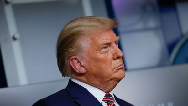 U.S. President Donald Trump listens to administration officials after speaking about prescription drug prices during an appearance in the Brady Press Briefing Room at the White House in Washington, U.S., November 20, 2020. - Sputnik International