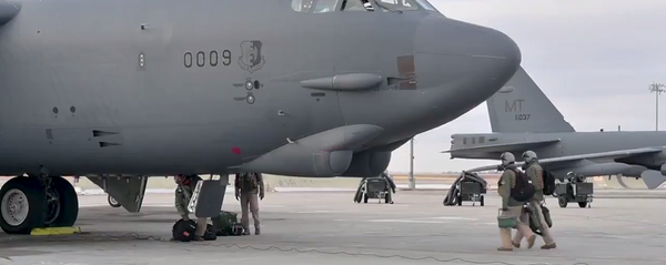 A screenshot of a video showing B-52 bomber being prepared for the flight at the military base in North Dakota, US A screenshot of a video showing B-52 bomber being prepared for the flight at the military base in North Dakota, US - Sputnik International