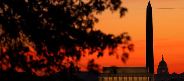 The sky turns shades of red as the sun rises behind the U.S. Capitol, the Washington Monument and the Lincoln Memorial in Washington, U.S., November 19, 2020. The sky turns shades of red as the sun rises behind the U.S. Capitol, the Washington Monument and the Lincoln Memorial in Washington, U.S., November 19, 2020. - Sputnik International