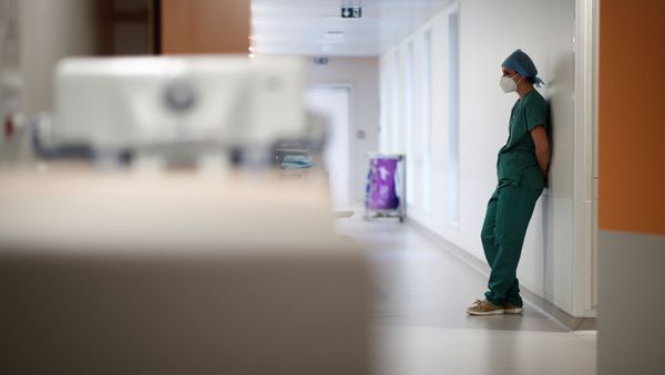 A medical staff member works in the Intensive Care Unit (ICU) where patients suffering from the coronavirus disease (COVID-19) are treated at the Melun-Senart hospital, near Paris, France, November 20, 2020 A medical staff member works in the Intensive Care Unit (ICU) where patients suffering from the coronavirus disease (COVID-19) are treated at the Melun-Senart hospital, near Paris, France, November 20, 2020 - Sputnik International