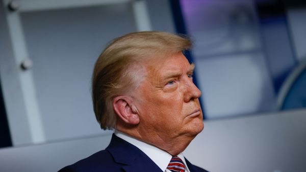 U.S. President Donald Trump listens to administration officials after speaking about prescription drug prices during an appearance in the Brady Press Briefing Room at the White House in Washington, U.S., November 20, 2020. - Sputnik International