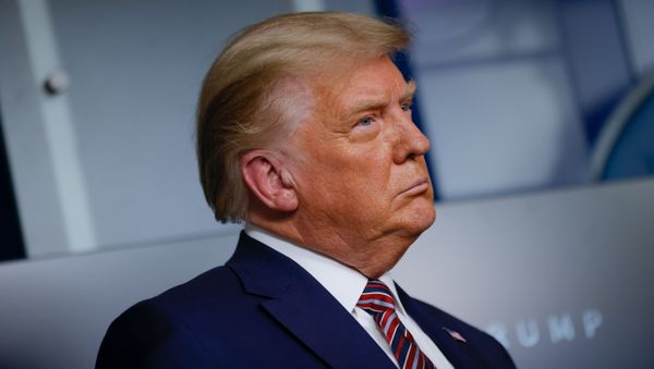 U.S. President Donald Trump listens to administration officials after speaking about prescription drug prices during an appearance in the Brady Press Briefing Room at the White House in Washington, U.S., November 20, 2020 - Sputnik International