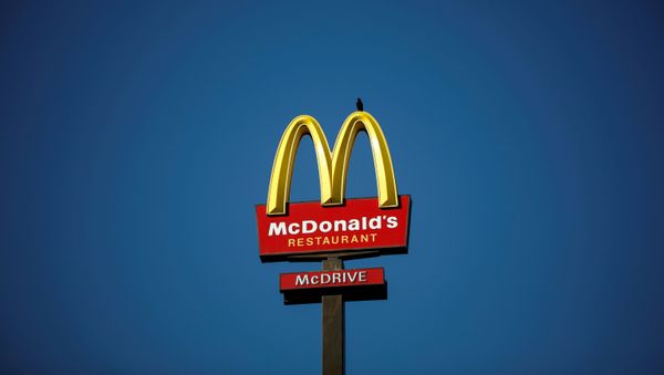 The McDonald's company logo stands on a sign outside a restaurant in Bretigny-sur-Orge, near Paris, France, July 30, 2020. - Sputnik International