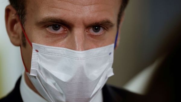 French President Emmanuel Macron listens during a visit to the 2020 Phoneton, an annual fundraising operation organised by the Hayastan All-Armenian Fund's French affiliate (Fonds Armenien de France) for the development of Armenia and Artsakh, in Paris, France November 21, 2020. Picture taken November 21, 2020 - Sputnik International