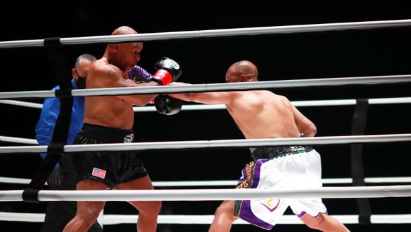 Mike Tyson (black trunks) fights Roy Jones, Jr. (white trunks) during a heavyweight exhibition boxing bout for the WBC Frontline Belt at the Staples Center.   - Sputnik International