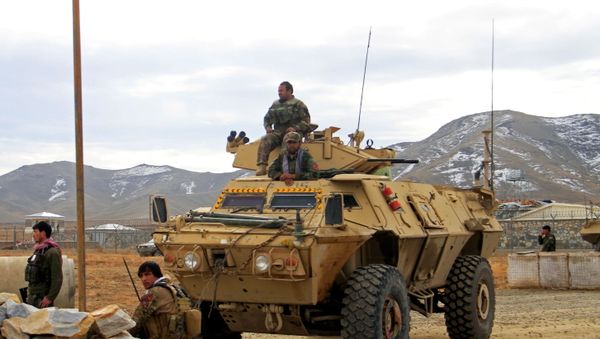 Afghan National Army soldiers keep watch outside of a military compound after a car bomb blast on the outskirts of Ghazni city, Afghanistan November 29, 2020. Afghan National Army soldiers keep watch outside of a military compound after a car bomb blast on the outskirts of Ghazni city, Afghanistan November 29, 2020. - Sputnik International
