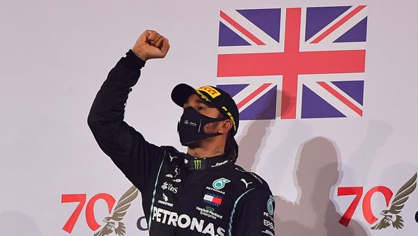 Formula One F1 - Bahrain Grand Prix - Bahrain International Circuit, Sakhir, Bahrain - November 29, 2020 Mercedes' Lewis Hamilton celebrates on the podium after winning the race  - Sputnik International