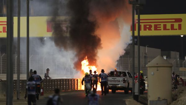 Bahrain International Circuit, Sakhir, Bahrain - November 29, 2020 Flames seen from the crash scene after Haas' Romain Grosjean crashed out at the start of the race - Sputnik International