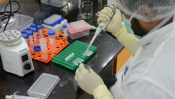 FILE PHOTO: A research scientist works inside a laboratory of India's Serum Institute, the world's largest maker of vaccines, which is working on vaccines against the coronavirus disease (COVID-19) in Pune, India, May 18, 2020. Picture taken May 18, 2020 - Sputnik International