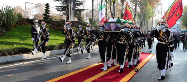 Members of Iranian forces carry the coffin of Iranian nuclear scientist Mohsen Fakhrizadeh during a funeral ceremony in Tehran, Iran November 30, 2020 - Sputnik International