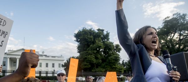 Center for American Progress President Neera Tanden speaks at a protest outside the White House, Tuesday, July 17, 2018, in Washington Center for American Progress President Neera Tanden speaks at a protest outside the White House, Tuesday, July 17, 2018, in Washington - Sputnik International