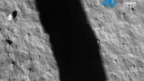 China's Chang'e-5 probe executed a successful landing on planned location on the moon at 11:11 pm Tuesday Beijing time, sending images of operation - Sputnik International