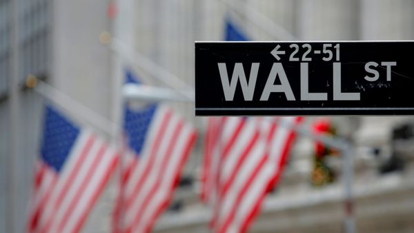 A street sign for Wall Street is seen outside the New York Stock Exchange (NYSE) in Manhattan, New York City, U.S. December 28, 2016. - Sputnik International