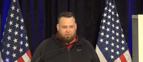 Screenshot from the video of The Amistad Project press conference, showing a truck driver Jesse Morgan delivering his remarks regarding the alleged US election fraud Screenshot from the video of The Amistad Project press conference, showing a truck driver Jesse Morgan delivering his remarks regarding the alleged US election fraud - Sputnik International