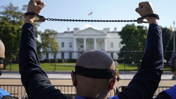 A member of the Uyghur American Association rallies in front of the White House, Thursday, Oct. 1, 2020, after marching from Capitol Hill in Washington, in support of the Uyghur Forced Labor Prevention Act which has passed the House and now will go on to the Senate. - Sputnik International