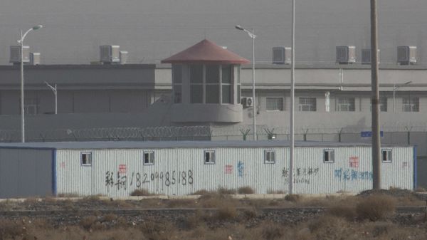 FILE - In this Monday, Dec. 3, 2018, file photo, a guard tower and barbed wire fences are seen around a facility in the Kunshan Industrial Park in Artux in western China's Xinjiang region. The U.S. Customd snd Border Protection on Wednesday said it will block imports from a major Chinese producer of cotton goods for its suspected use of workers detained as part of a crackdown on ethnic minorities in China's northwest - Sputnik International