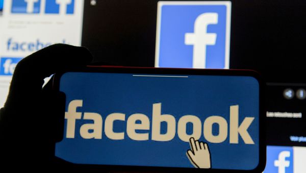 The Facebook logo is displayed on a mobile phone in this picture illustration taken December 2, 2019 - Sputnik International